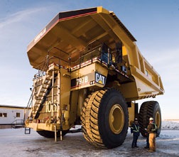 GPS-equipped open-pit haulers carry nearly 400 tons per trip.
