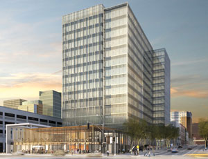 A seismic retrofit is part of plans to transform an unappealing 1960s-era office building (below) into a sleek, daylight-filled structure (this image).