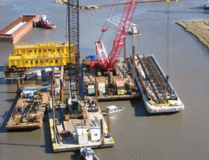 Pile driving for $695 million IHNC barrier. Cost expected to climb.