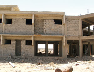 Iraqi prison job was halted, but Ministry of Defense building was completed.