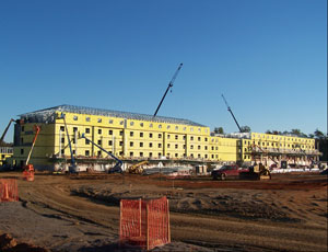 Prefab Purcell Construction Corp., Watertown, N.Y., has two contracts to build six five-story barracks buildings at Fort Lee, Va., using prefabricated structural steel panels. Purcell owns its own fabricating plant in Watertown. Michael A. Roach, the Corps’ resident engineer, says plumbing waste stacks and water risers, electrical panels and room wiring kits are pre-assembled. Each 181,000-sq-ft building will house 624 soldiers, two to a room. The first was turned over on July 8 after 18 months of design and construction. Purcell’s winning bid in December 2007 for the first set of three buildings was $119, 539,701. Its winning bid for the second nearly identical set of three buildings, in June, was $89,984,000. “The economy is really making our prices very competitive,” says Roach.