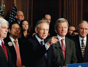 The Democratic leadership, including Senate Majority Leader Harry Reid (D-Nev.), center, were jubilant after the Senate voted to approve the $871-billion health care reform bill early on Christmas Eve.