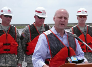 New Orleans Mayor Mitch Landrieu saluted the Corps for being “on task and on time” with the project and for building levees “better than before.” Left to right behind are Col. Robert Sinkler, commander of the U.S. Army Corps of Engineers’ Hurricane Protection Office in New Orleans, Lt. Gen. Robert Van Antwerp, chief of the Corps, and Brig. Gen. Michael Walsh, commander of the Corps’ Mississippi Valley Division.