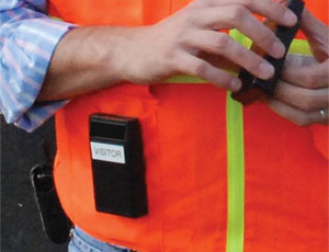 Warning device worn by a worker approaching a danger zone emits a signal picked up by a device in the equipment’s cab.