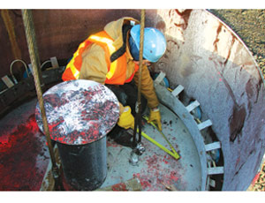  Matt Landon, a project engineer for WRPS, the cleanup contractor at the Hanford nuclear-waste site in Washington state, measures the progress of a concrete cutting tool during a test on a simulated underground waste-tank dome.