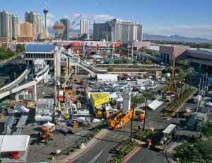 Caterpillar’s new truck model (far right) was unveiled at the opening of the 2011 CONEXPO in Las Vegas, where construction industry attendees expressed hope that the recession is fading.