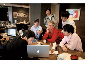 Japanese and American engineers study images and data-collection protocols during a meeting in Sendai as one set of ASCE researchers prepares to return to the U.S. with samples and data.