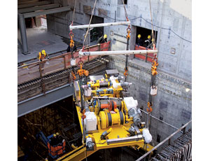 Equipment is lifted into a vitrification plant at a DOE nuclear waste site.